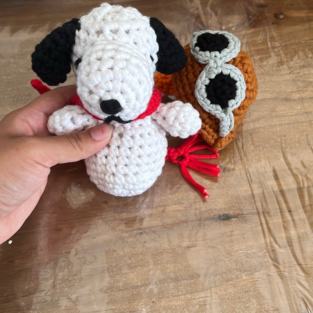 Crocheted snoopy with scarf and hat